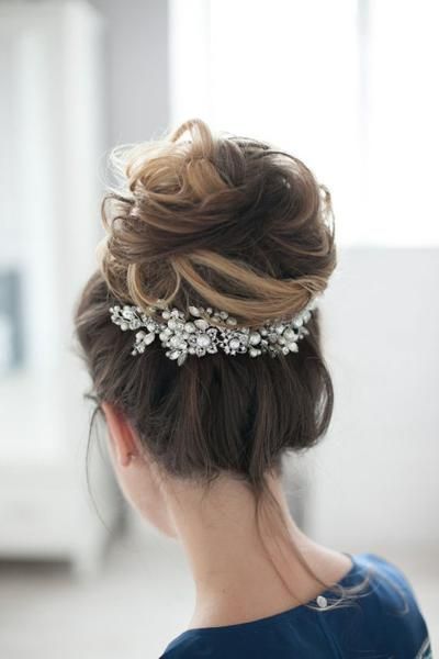 Acconciature sposa chignon alto